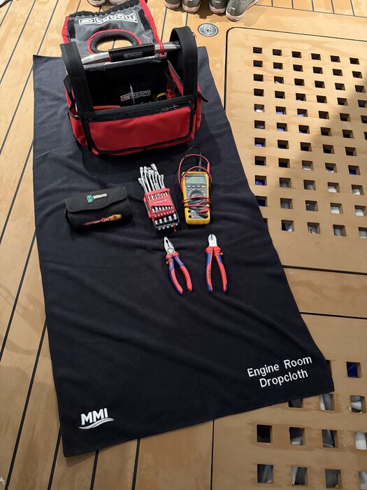 MMI Engine Room Dropcloth with tools laid out in a technical space