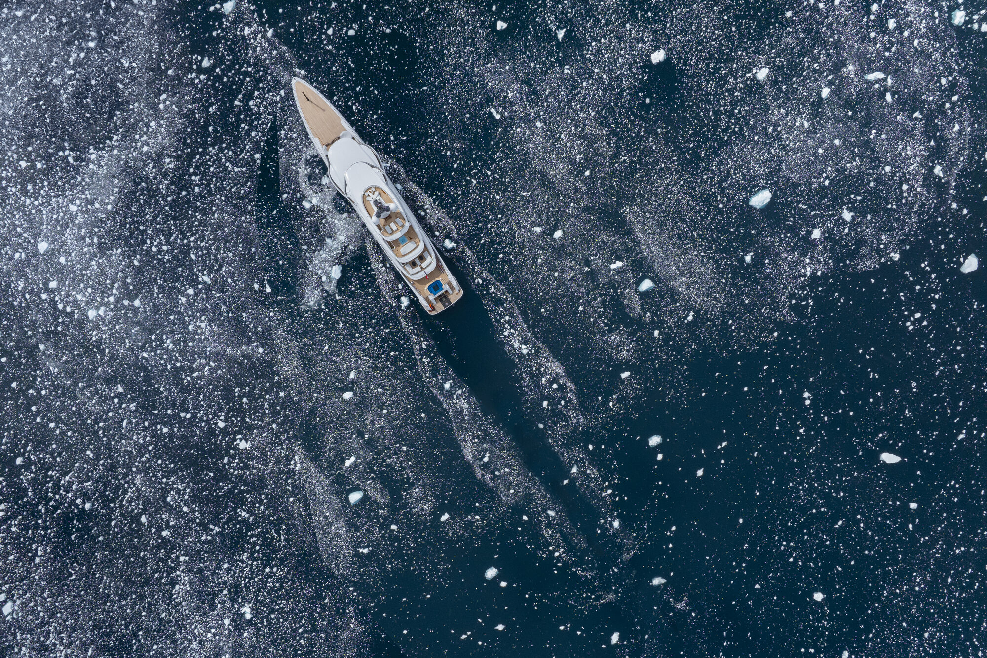 Aerial view of a superyacht underway