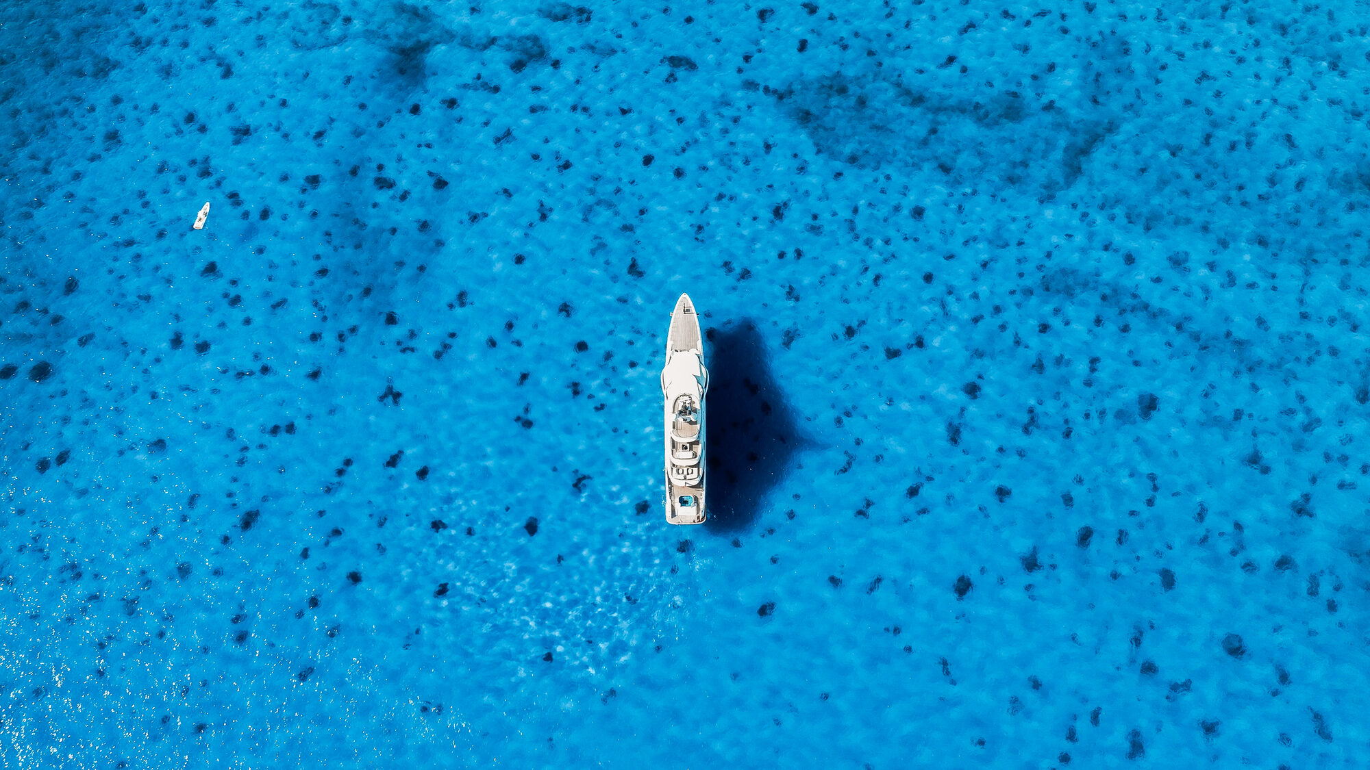 Superyacht at anchor seen from above